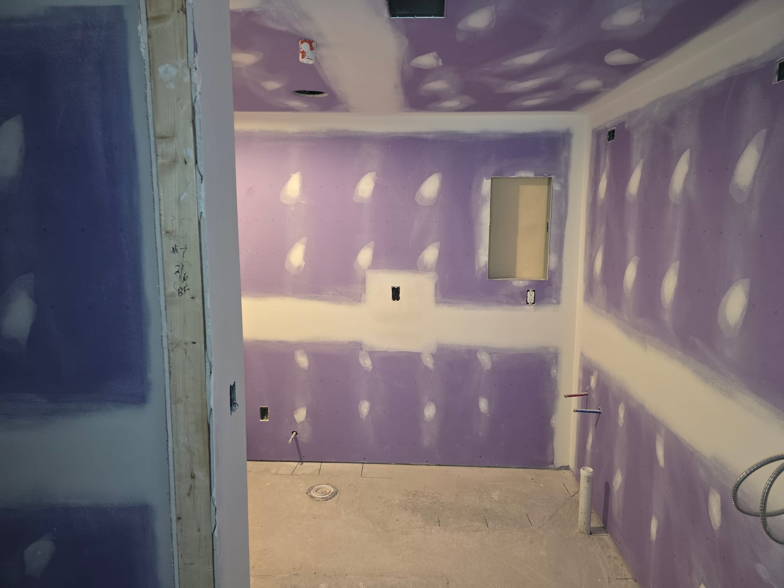 Finished wall after water damage drywall repair and paint prep, Delaware