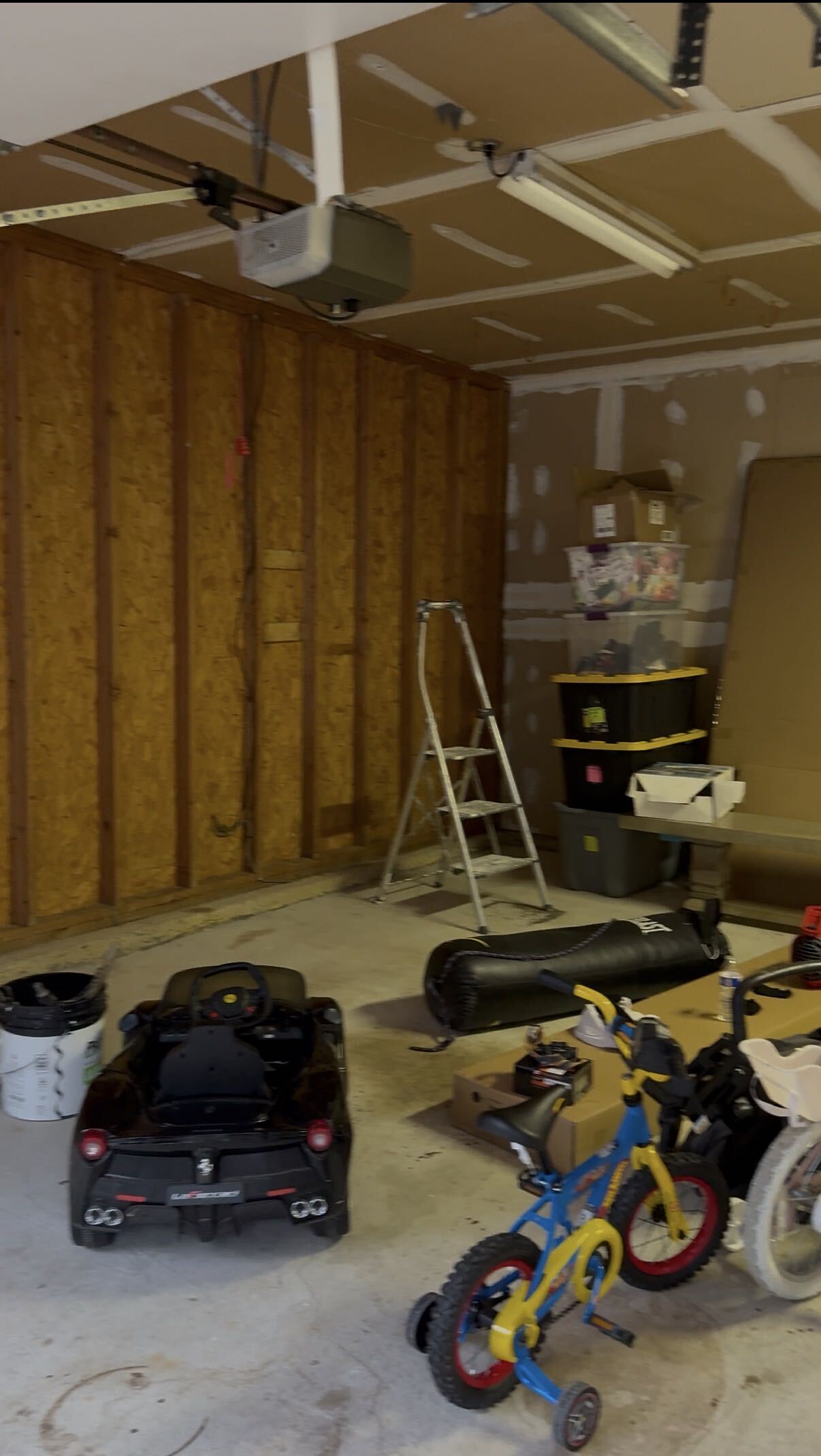 Unfinished garage with bare studs and insulation